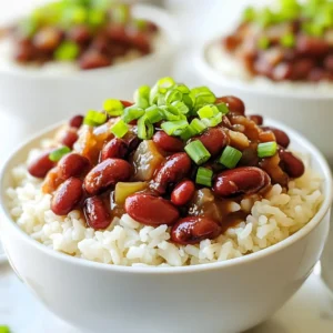 To make Louisiana Red Beans and Rice, gather these key ingredients: - 1 cup dried red kidney beans (or 1 can of red kidney beans, drained and rinsed) - 1 tablespoon vegetable oil - 1 medium onion, finely chopped - 1 bell pepper (any color), finely chopped - 2 stalks of celery, diced - 3 cloves garlic, minced - 1 teaspoon smoked paprika - 1 teaspoon dried thyme - 1 teaspoon cayenne pepper (adjust to your spice preference) - 1 bay leaf - 4 cups vegetable broth (or chicken broth if desired) - 1 cup long-grain white rice - 1 tablespoon apple cider vinegar - Salt and black pepper to taste - Fresh green onions, chopped (for garnish) For a deeper taste, consider adding: - 1-2 smoked sausages, sliced - A few dashes of hot sauce - Fresh parsley, chopped for garnish These optional ingredients can enhance the dish's flavor profile. Smoked sausage adds a savory touch. Hot sauce gives it a spicy kick. Fresh parsley brightens the dish’s look and taste. You can make some swaps if you’re missing an ingredient: - Use canola oil instead of vegetable oil. - Substitute white rice with brown rice for a healthier option. - If you want less heat, reduce the cayenne pepper or skip it entirely. These substitutions keep the recipe tasty and flexible. Don't hesitate to adjust to your taste! {{ingredient_image_2}} If you choose dried red kidney beans, rinse them well. Soak them in a large bowl of water overnight. This step helps the beans cook evenly and become tender. If you use canned beans, just drain and rinse them. This saves time and gives you that same great taste. Grab a large pot or Dutch oven. Heat one tablespoon of vegetable oil over medium heat. Add one finely chopped onion, one bell pepper, and two diced celery stalks. Sauté them for about 5-7 minutes. Stir them often until the veggies soften and smell great. This builds a tasty base for your dish. Now it's time to add flavor. Stir in three minced garlic cloves, one teaspoon of smoked paprika, one teaspoon of dried thyme, and one teaspoon of cayenne pepper. Cook this for about 1-2 minutes, stirring frequently. Then, if you soaked your beans, drain and rinse them. Add the beans and one bay leaf to the pot. Pour in four cups of vegetable broth. Bring the mix to a strong boil. Once boiling, lower the heat to low. Cover the pot and let it simmer gently for 1.5 to 2 hours. Stir it occasionally. If it gets too thick, add more broth. You want the beans to be tender and flavorful. While the beans simmer, cook the rice. Bring 2 cups of water to a boil in a separate pot. Stir in 1 cup of long-grain white rice. Lower the heat and cover. Cook it for about 20 minutes or until the rice is fluffy and tender. This will be the perfect side to your beans. Once the beans are tender, remove the bay leaf. Stir in one tablespoon of apple cider vinegar. Season with salt and black pepper to taste. Mix everything well to combine the flavors. To serve, spoon a generous amount of rice into a bowl. Top it with the red bean mixture. Finish with freshly chopped green onions for color and extra flavor. Enjoy this warm and filling dish! To get the best taste, focus on the spices. Smoked paprika gives a nice depth. Adjust cayenne pepper to your spice level. Fresh herbs can also brighten the dish. Use fresh green onions as a garnish for added flavor. Don't rush the sauté step; let the veggies soften well. Cooking times matter. If you use dried beans, soak them overnight. They should cook for 1.5 to 2 hours. Stir occasionally and watch the thickness. Add more broth if it gets too thick. For rice, follow package instructions closely. Usually, it takes about 20 minutes to cook. Serve Louisiana red beans and rice in deep bowls. Spoon the beans over a mound of rice. Garnish with green onions for color. This dish pairs great with cornbread. You can also enjoy it with a salad for freshness. Pro Tips Soak for Success: Soaking dried kidney beans overnight helps to reduce cooking time and improve their texture, making them creamier. If you're short on time, a quick soak method can be used by boiling them for 5 minutes and letting them sit for an hour. Spice It Up: Adjust the cayenne pepper according to your heat preference. If you're unsure, start with a smaller amount and add more later, as the flavors will deepen as the dish simmers. Broth Matters: Using a flavorful broth, whether vegetable or chicken, enhances the overall taste of the dish. Consider adding a splash of hot sauce to the broth for an extra kick! Rest for Flavor: Allow the dish to sit for a few minutes after cooking before serving. This resting period lets the flavors meld together beautifully, resulting in a more delicious meal. {{image_4}} Adding meat makes this dish even heartier. Common choices include smoked sausage, ham hocks, or chicken. These meats bring a smoky flavor that enhances the beans. For the best taste, add the meat during the sauté step. This allows the meat's juices to blend with the veggies and spices. If you prefer a meatier dish, you can add about 1 pound of diced sausage or ham. You can easily make this dish vegetarian or vegan. Simply use vegetable broth instead of chicken broth. If you want to add protein, consider using tofu or tempeh. Cook them separately and stir them in at the end. This way, they absorb the great flavors without losing their texture. Different regions have their own takes on red beans and rice. In New Orleans, you'll find spices like cayenne and thyme. In other areas, you might see different herbs or legumes. Some people even add tomatoes for a tangy twist. Explore these variations to find what you love best. Don’t be afraid to get creative with your spices and ingredients! To keep your Louisiana red beans and rice fresh, first let it cool. Then, transfer it to an airtight container. Store it in the fridge for up to four days. If you used canned beans, the dish will last about the same time. Always check for any off smells or mold before eating leftovers. When you're ready to enjoy leftovers, heat them gently. You can use the microwave or a pot on the stove. If using the stove, add a splash of broth or water to keep it moist. Heat until it’s hot throughout. Stir occasionally to ensure it warms evenly. For long-term storage, freeze the dish in portions. Use freezer-safe containers or bags. Be sure to leave some space in the container for expansion. Label the containers with the date. It can last for about three months in the freezer. To reheat, thaw in the fridge overnight and follow the reheating instructions above. Yes, you can use canned beans. Just drain and rinse them well. This saves time. Canned beans are soft, so adjust cooking time. Add them in the last 30 minutes of cooking. The recipe includes cayenne pepper, which adds heat. You can adjust the spice to your taste. Start with less if you prefer mild flavors. You can always add more later. Serve with cornbread for a classic touch. A side salad adds freshness. You can also pair it with fried plantains or coleslaw. Each side brings a unique flavor to the meal. The dish lasts about 3 to 4 days in the fridge. Store it in an airtight container. Reheat it on the stove or microwave before serving. Enjoy the flavors all over again! This blog post covered how to make a delicious Louisiana Red Beans and Rice dish. We discussed key ingredients, cooking steps, and lots of tips. You learned about variations, storage, and answers to common questions. Now you can create a tasty meal with easy steps. Enjoy your cooking adventure! With practice, you’ll master this classic dish and impress your friends and family.