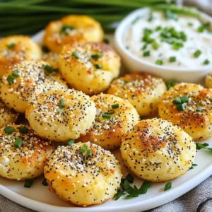 To make Keto Everything Bagel Bites, you need the right ingredients. Here&rsquo;s what you&rsquo;ll need: - 2 cups almond flour - 1 tablespoon baking powder - 1 teaspoon garlic powder - 1 teaspoon onion powder - 1 teaspoon ground sea salt - 2 large eggs - 1 cup shredded mozzarella cheese - 2 tablespoons cream cheese, softened - 2 tablespoons everything bagel seasoning These ingredients work together to create a tasty, low-carb snack that captures the delicious flavors of a classic bagel. If you want to make this recipe even lighter, try these substitutes: - Use coconut flour instead of almond flour. - Swap cream cheese with a dairy-free alternative, like cashew cream. - Replace mozzarella with a low-fat cheese option. These swaps can help you adjust the recipe to fit your dietary needs while keeping it low-carb. To prepare these bagel bites, you&rsquo;ll want to gather a few tools: - Mixing bowls (large and medium) - Whisk for blending ingredients - Baking sheet - Parchment paper for easy clean-up - Measuring cups and spoons for accuracy Having these items ready makes cooking smooth and fun! {{ingredient_image_2}} First, set your oven to 375&deg;F (190&deg;C). This helps the bagel bites cook evenly. While it heats, grab a baking sheet. Line it with parchment paper to stop the bites from sticking. This step is key for easy cleanup. In a large bowl, combine 2 cups of almond flour, 1 tablespoon of baking powder, 1 teaspoon of garlic powder, 1 teaspoon of onion powder, and 1 teaspoon of ground sea salt. Use a whisk to mix well. Make sure no clumps are left. A good mix ensures every bite has flavor. In another bowl, crack two large eggs. Whisk them until blended. Then, add 1 cup of shredded mozzarella cheese and 2 tablespoons of softened cream cheese. Mix until smooth. This creamy blend adds richness to your bagel bites. Now, slowly add the dry mix to the wet mix. Stir continuously. You want all the ingredients to combine into a sticky dough. If it feels too sticky, wet your hands slightly. This helps when you shape the dough. With your hands, take small portions of dough. Roll them into balls, about 1 inch wide. Place each ball on the baking sheet, leaving 1-2 inches of space between them. This space allows the bites to puff up as they bake. Sprinkle everything bagel seasoning on top of each ball. Make sure they are coated well for that classic taste. Then, place the baking sheet in the oven. Bake for 12-15 minutes. Look for a golden brown color. When done, take them out and let them cool on the sheet for a few minutes. This cooling time helps them firm up before you enjoy them. To get the dough just right, mix well. Start with the dry ingredients. Whisk them until they blend. Then, combine wet ingredients slowly. Mix until it forms a sticky dough. If the dough sticks too much, wet your hands. This helps shape the bites easily. You can store the bagel bites in an airtight container. Keep them in the fridge for up to three days. For reheating, use your oven for the best results. Place the bites on a baking sheet. Heat them at 350&deg;F (175&deg;C) for about 5-7 minutes. This keeps them crispy on the outside. Serve your bagel bites on a nice platter. Add some color with fresh herbs like chives or parsley. For extra flavor, pair them with a creamy dip. A keto-friendly cheese spread works great too. Enjoy these bites at parties or as a snack! Pro Tips Use Room Temperature Ingredients: Allow your cream cheese and eggs to come to room temperature before mixing. This helps create a smoother dough and ensures even baking. Experiment with Seasonings: Feel free to customize the seasoning blend! Add sesame seeds, poppy seeds, or even a dash of cayenne pepper for a spicy kick. Check for Doneness: Keep an eye on your bagel bites as they bake. If they start to brown too quickly, you can cover them loosely with foil to prevent burning while they finish cooking. Storage Tips: Store any leftovers in an airtight container in the fridge for up to 3 days. Reheat in the oven for a few minutes to regain their crispiness. {{image_4}} You can change the flavors of your bagel bites easily. Try adding fresh herbs like dill or chives for a bright taste. You can also add sundried tomatoes or olives for a Mediterranean twist. Want something sweet? A touch of cinnamon and a few drops of vanilla can make a fun dessert version. Experiment with different spices to find your favorite mix! If you want to try different cheeses, feel free to swap them! Cream cheese can be replaced with goat cheese for a tangy taste. Cheddar cheese works well too, adding a sharp flavor. For a creamier texture, use ricotta. Each cheese brings a new character to the bites and keeps things exciting. For those who love heat, make spicy everything bagel bites! Add a dash of red pepper flakes to the dough. You can also mix in jalape&ntilde;os for a kick. Top with spicy everything bagel seasoning to intensify the heat. These bites will wake up your taste buds and add a fun twist to your snack! Keto Everything Bagel Bites are perfect for low-carb diets. Each bite has about 100 calories. This makes them a great snack without guilt. You can enjoy them while staying on track with your keto goals. These bagel bites provide a good balance of fats, proteins, and carbs. Each serving has roughly: - Fat: 6 grams - Protein: 7 grams - Net Carbs: 2 grams This profile helps maintain energy without spiking your blood sugar. The ingredients in these bagel bites offer great health perks: - Almond Flour: This is low in carbs and high in healthy fats. It also has fiber, which aids digestion. - Eggs: Packed with protein and nutrients, they help keep you full longer. - Mozzarella Cheese: This cheese is low in carbs and a good source of calcium. It adds flavor and texture. - Everything Bagel Seasoning: This mix adds flavor and includes onion and garlic, which may boost heart health. These ingredients come together to make a tasty snack that fits into a healthy lifestyle. Yes, you can freeze these bagel bites. After baking, let them cool completely. Then, place them in a freezer-safe bag or container. They will stay fresh for up to three months. When you want to eat them, just thaw them in the fridge overnight. You can also reheat them in the oven for a few minutes at 350&deg;F. This keeps them soft and tasty. To make these bagel bites dairy-free, you can swap the mozzarella and cream cheese. Use dairy-free cheese alternatives that melt well. Look for brands made from nuts or soy. You can also try using cashew cream instead of cream cheese. This will help you keep the creamy texture while staying dairy-free. These bagel bites pair well with many dips and spreads. Some great options include: - Creamy avocado dip - Keto-friendly ranch dressing - Hummus (check for low-carb versions) - Cream cheese (plain or flavored) - A side of fresh veggies for crunch You can also serve them with fresh herbs on top for added flavor. You learned how to make tasty Keto Everything Bagel Bites. We covered ingredients, tools, and detailed steps to create them. You now know tips for perfect dough and fun serving ideas. Many variations can spice things up too. Plus, understanding the nutrients helps you enjoy these bites guilt-free. With this guide, you can bake delicious snacks while sticking to your diet. Happy cooking!