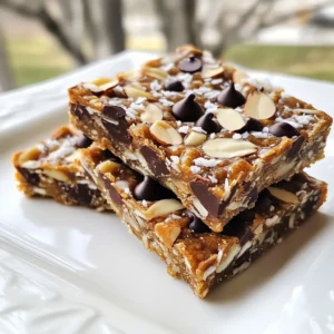 To make Almond Joy Energy Bars, you need a few key ingredients. Here&rsquo;s what you&rsquo;ll need: - 1 cup creamy almond butter - 1/2 cup honey or maple syrup - 1 1/2 cups rolled oats - 1/2 cup unsweetened shredded coconut - 1/2 cup dark chocolate chips - 1/2 cup chopped almonds - 1/4 teaspoon sea salt - 1 teaspoon pure vanilla extract These ingredients create a yummy, chewy bar that tastes like a treat. The almond butter gives a rich flavor, while the oats add texture. The chocolate chips and coconut offer that classic Almond Joy taste. If you have allergies, you can still enjoy these bars. Here are some swaps: - Use sunflower seed butter instead of almond butter for nut-free options. - Swap honey for agave syrup if you want a vegan option. - Use gluten-free oats if you need to avoid gluten. - Dark chocolate chips can be replaced with carob chips for a different flavor. These swaps help you make the bars safe for everyone. Choosing fresh ingredients makes a big difference in taste. Here are some tips: - Look for almond butter that has no added sugar or oils. - Check oats for freshness; they should smell nutty, not stale. - Choose coconut that is unsweetened to keep it healthy. - For chocolate chips, pick high-quality brands for better flavor. - When buying almonds, select roasted ones for extra crunch. Fresh ingredients not only taste better but also keep your bars nutritious. Enjoy making these tasty snacks! {{ingredient_image_2}} Start by taking a large mixing bowl. Combine 1 cup of creamy almond butter with 1/2 cup of honey or maple syrup. Mix them well until you have a smooth and creamy blend. Next, add 1 teaspoon of pure vanilla extract and 1/4 teaspoon of sea salt. Stir until everything is well combined. This mixture will be the tasty base for your energy bars. Now, it&rsquo;s time to add the dry ingredients. Gradually mix in 1 1/2 cups of rolled oats, 1/2 cup of unsweetened shredded coconut, 1/2 cup of chopped almonds, and 1/2 cup of dark chocolate chips. Make sure to mix thoroughly. You want all the ingredients to blend well. The mixture should feel thick and sticky. This texture helps the bars hold together when cut. Prepare an 8x8 inch square baking dish by lining it with parchment paper. Leave some paper hanging over the sides for easy removal later. Transfer your mixture into the dish. Use a spatula or your hands to press it down tightly. This step is key for a good texture. Once packed, cover the dish with plastic wrap and place it in the fridge. Chill for at least 1 hour. This helps the bars firm up. After chilling, lift the bars out using the parchment paper. Cut them into squares or rectangles. Now, you have tasty and nutritious Almond Joy Energy Bars ready to enjoy! To get the best texture in your Almond Joy Energy Bars, press the mixture firmly. This helps the bars hold together well. Use a spatula or your hands to pack it tightly in the pan. If you want a softer bar, reduce the oats slightly. If you like it crunchier, add more chopped almonds. Chilling the bars for at least one hour is key. This step firms them up for easy slicing. Store your energy bars in an airtight container. Keeping them in the refrigerator helps them stay fresh for up to two weeks. If you want them to last longer, freeze them. Wrap each bar in plastic wrap, then place them in a sealed bag. This keeps them from drying out. Always label the bag with the date you made them. You can customize these energy bars easily. Try adding dried fruits like cranberries or apricots for extra sweetness. For a nut-free option, use sunflower seed butter instead of almond butter. Want more protein? Mix in some protein powder or chia seeds. You can also swap the dark chocolate chips for white chocolate or even carob chips. The choice is yours! Pro Tips Use Fresh Ingredients: Always opt for fresh almond butter and high-quality chocolate chips to enhance the flavor of your energy bars. Customize Your Nuts: Feel free to experiment with different nuts, like pecans or walnuts, to add variety to your energy bars. Toast the Coconut: Toasting the shredded coconut before adding it to the mixture can intensify its flavor and add a delightful crunch. Chill for Perfect Texture: Make sure to chill the bars for at least an hour to achieve the right firmness, making them easier to cut and handle. {{image_4}} You can change the flavors of your Almond Joy Energy Bars easily. For a richer taste, try adding more dark chocolate chips. You can also use a mix of dark and milk chocolate for a sweeter treat. If you want a stronger coconut flavor, use more shredded coconut. Toast it lightly for an extra burst of flavor. You might even sprinkle some cocoa powder into the mix for a deeper chocolate taste. If you want to boost the protein in your bars, add protein powder. A scoop of chocolate protein powder works well. You can also use seeds like chia or hemp for added nutrition. These small seeds pack a big punch. They add protein, fiber, and healthy fats. You can mix in nut butter for a creamier texture and more protein too. For those with nut allergies, you can still enjoy these bars. Use sunflower seed butter instead of almond butter. It has a similar creamy texture. Replace the chopped almonds with pumpkin seeds or sunflower seeds. These seeds add crunch and a nutty flavor without the nuts. You can still use chocolate chips, but check to make sure they are nut-free. This way, everyone can enjoy the tasty energy bars. To keep your Almond Joy Energy Bars fresh, store them in an airtight container. Place the container in your fridge. This helps maintain their taste and texture. You can enjoy the bars for up to two weeks when refrigerated. Make sure to check for any moisture inside the container to avoid sogginess. If you want to store the bars for a longer time, freezing is a great option. Wrap the bars tightly in plastic wrap before placing them in a sealed bag. This keeps them safe from freezer burn. Frozen Almond Joy Energy Bars can last for up to three months. When you&rsquo;re ready to eat, thaw them in the fridge overnight. Always check your bars before eating. If they look dry or have any odd smell, it&rsquo;s best to discard them. Mold is another clear sign of spoilage. If you notice any changes, especially after a while, trust your senses. Safe eating is always the best choice. Almond Joy Energy Bars can last up to two weeks in the fridge. Store them in an airtight container to keep them fresh. If you want to save them longer, freeze them in a sealed bag. They can stay good for up to three months in the freezer. Yes, you can use other nut butters! Peanut butter, cashew butter, or sunflower seed butter all work well. Each nut butter will change the flavor a bit, so choose what you like best. Just make sure your nut butter is creamy for easy mixing. Absolutely! These energy bars are perfect for meal prep. You can make a big batch ahead of time. Store them in portions for easy snacks throughout the week. They are great for busy days when you need a quick energy boost. In this article, we explored how to make Almond Joy Energy Bars. We covered the main and substitute ingredients, plus tips for choosing fresh items. I shared step-by-step instructions for mixing and chilling the bars. You also learned how to get the best texture and store them well. These energy bars are easy to customize with your favorite flavors. Remember to check for spoilage to enjoy them longer. With these tips, making delicious energy bars at home is simple and fun. Enjoy your snacks!